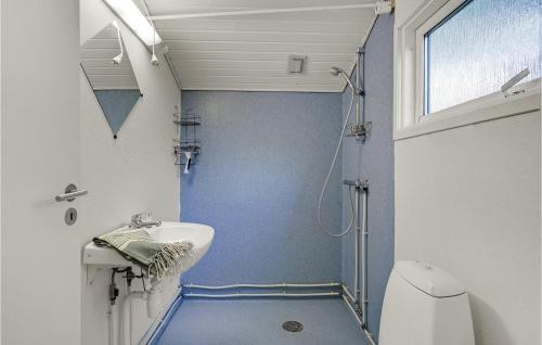 a small bathroom with a sink and a toilet at Stunning Home In Hampen With Wifi in Hampen