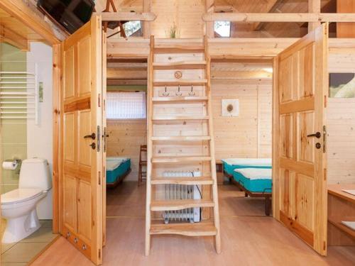 a room with two bunk beds and a toilet at Holiday houses near the seaside beach, Pobierowo in Pobierowo