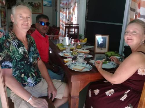 a man and a woman sitting at a table at LD RoomA DunhidA in Badulla
