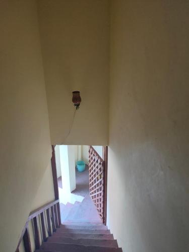 a view of a stairway in a house at ROOP MOUNTAIN HOMESTAY No Parking in Manāli