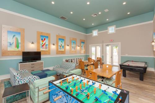 a living room with a pool table at SouthernVilla Ticket to Paradise in Palm Coast