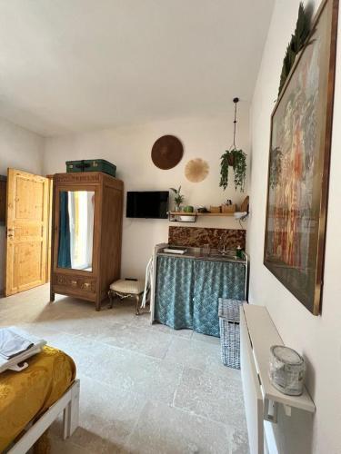 a living room with a bed and a table at Le Tre Terrazze in Bologna