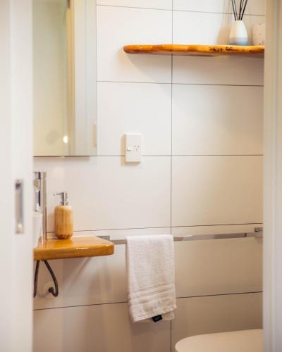 a bathroom with a sink and a toilet at Futuna Rocks Motel in Kaikoura