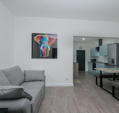 a living room with a couch and a table at Apex Living NE - Carnegie House 4 Bed House, FREE PARKING FREE WiFi in Ryhope