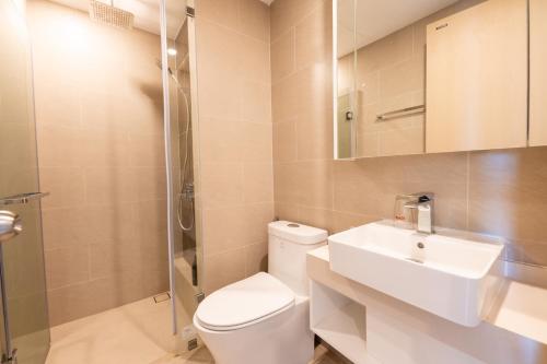 a bathroom with a toilet and a sink and a shower at The Song Luxury Condotel Vung Tau - Căn hộ cao cấp Luca's House in Vung Tau