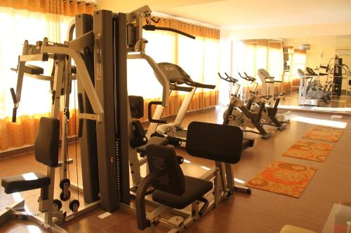 a gym with a bunch of tread machines in it at Sai Gon Dong Ha Hotel - a member of Saigontourist Group in Quảng Trị