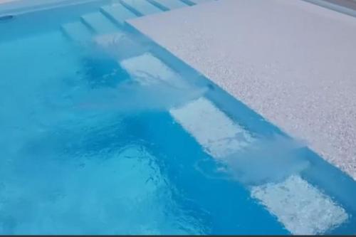 a pool of water with blue lights on the floor at Luxury Villa Četiri Hrasta in Pićan