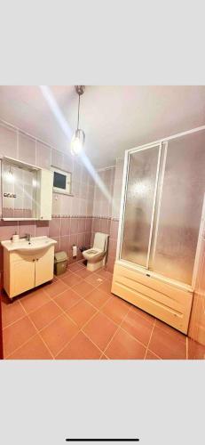 a bathroom with a toilet and a sink and a shower at Private Room in Istanbul #85 in Arnavutköy