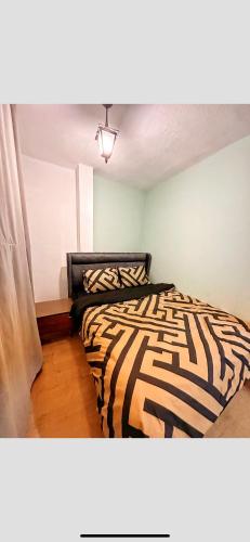 a bedroom with a zebra print bed with a window at Private Room in Istanbul #85 in Arnavutköy