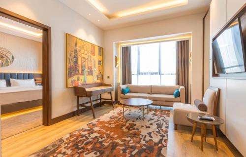 a living room with a couch and a table at Wellness Park Hotel Turon in Samarkand