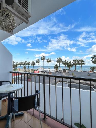 a balcony with a view of the beach and the ocean at Beatriz Charming Hostal in Torremolinos