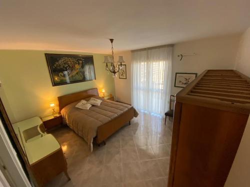 a large bedroom with a bed and a window at Residenze BepiLù in Bari