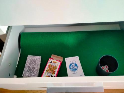 a white box with four playing cards in it at Península de la paz in Lugo