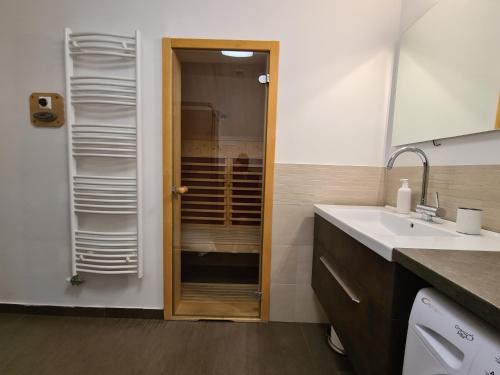 a bathroom with a sink and a mirror at Apartments Katja in Kranjska Gora