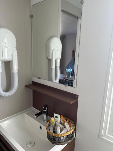 a bathroom with a sink and a mirror at Agricampeggio Cà di Mazza in Monzuno