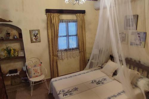 a bedroom with a bed and a window at Casa Elvira 