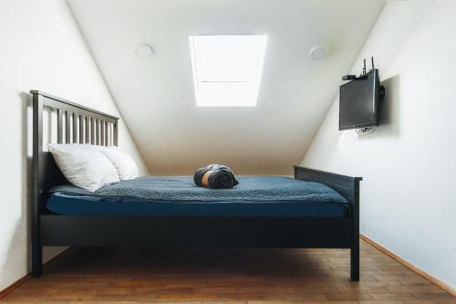 a bed with a pillow on it in a room at Backspace Apartments in Vršac