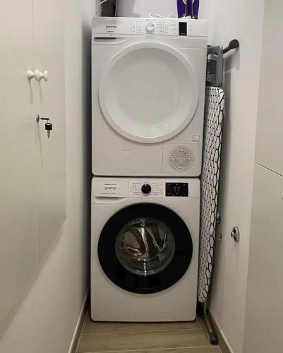 a washer and dryer in a small room at Cloe Apartment in Split