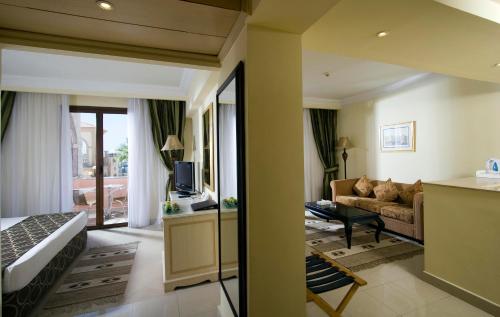 a hotel room with a bed and a living room at IL Mercato Hotel & Spa in Sharm El Sheikh
