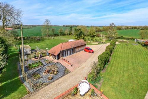 an aerial view of a house with a garden at Well Cottage Country Accommodation in Brockley Green