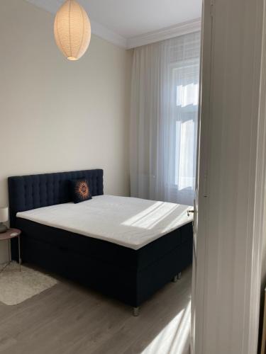 Posteľ alebo postele v izbe v ubytovaní B16 Gellert Apartment Budapest
