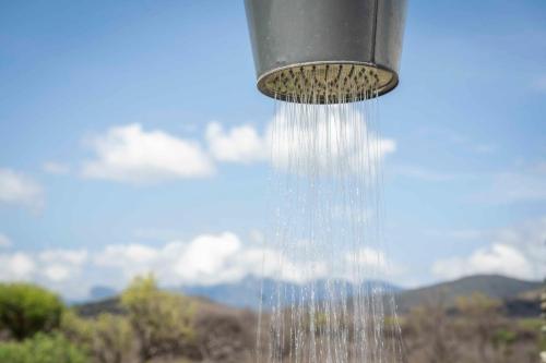 a stream of water pouring out of a bird feeder at Kruger Cliffs Lodge - Absolute privacy guaranteed in Hoedspruit