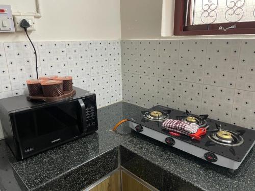Cuisine ou kitchenette dans l'établissement Holiday Home #Vibrant#Hear of the City #Family Only