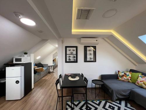 a living room with a couch and a table at MAIN SQUARE Apartment in Belgrade