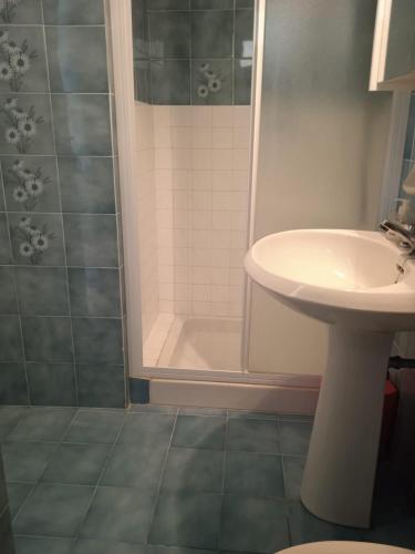 a bathroom with a sink and a shower at Villa Imperia in Imperia