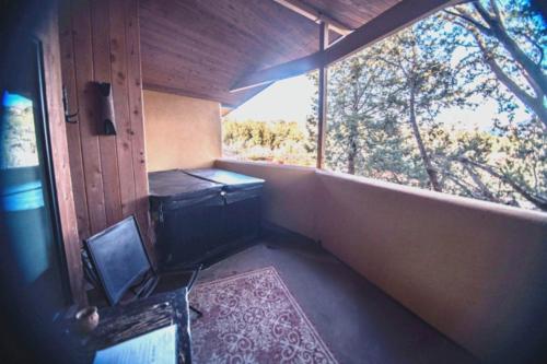 a small room with a window and a toilet at The Inn at Thunder Mountain in Sedona