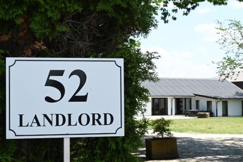 a speed limit sign in front of a house at Landlord in Holsbeek