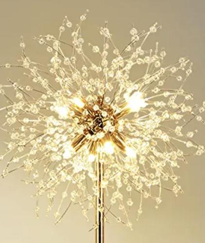 a vase filled with flowers with lights in it at B&B Margot in Albavilla