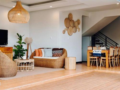 a living room with a couch and a table at Villa Sriwedari - Seminyak in Seminyak