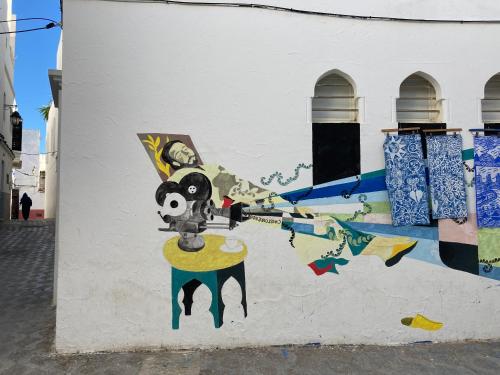 a painting on the side of a building at Dar Said in Asilah