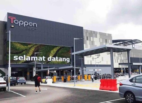 a man is standing in front of a car dealership at Gaya Homestay 3Bed 2Bath 12pax Taman Gaya JB 5min to Aeon&Ikea 高雅民宿 in Ulu Tiram