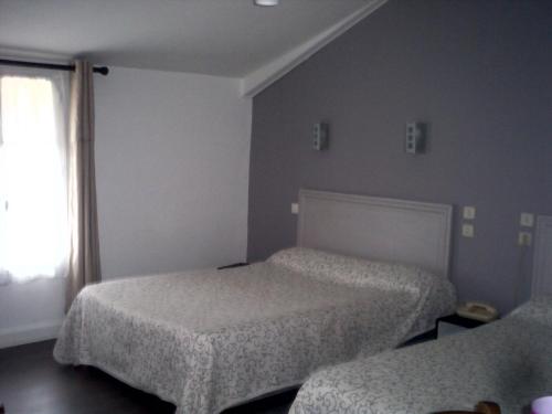 Cama o camas de una habitación en Le Ranfort Chambres d'Hôtes