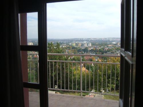 a view of a city from a window at Panoráma apartman in Pécs
