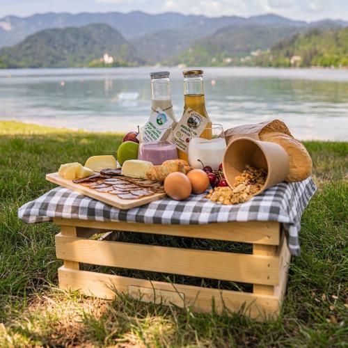 a picnic basket filled with food and bottles of beer at Apartments Ladka in Begunje na Gorenjskem