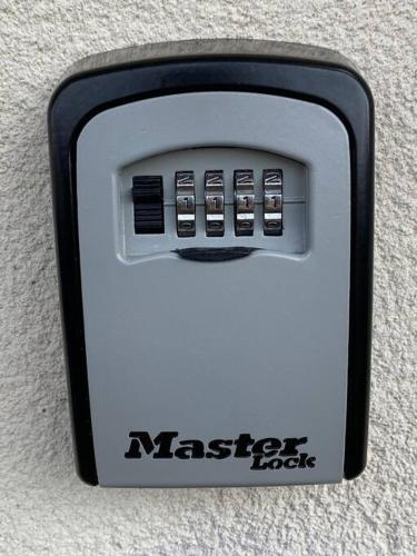 a nesync box with five buttons on it at Compact Modern Apartment Single Person or Couple Only in Bangor