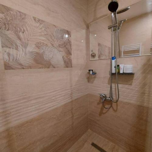 a bathroom with a shower with a shower at Семи гарден in Borovets