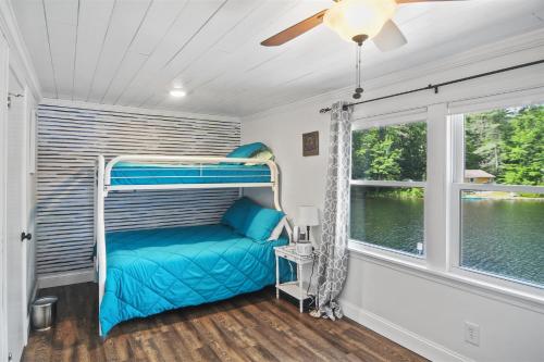 a bedroom with a bunk bed and a window at RANDALL LAKE RETREAT-LIMIT 7 villa 