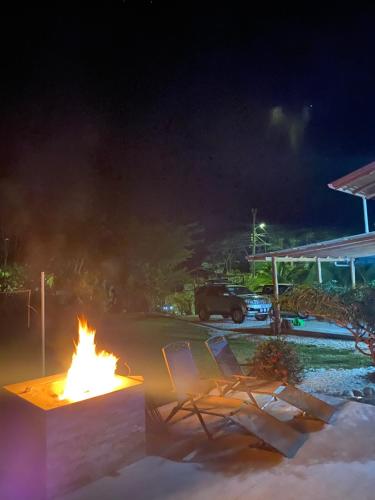a fire pit in a parking lot at night at Casa Gratitud in Paquera