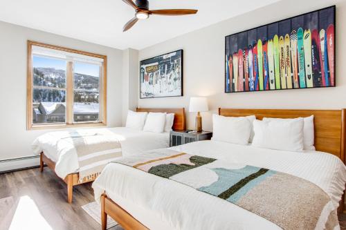 a bedroom with two beds and a window at Chapel Place in Avon