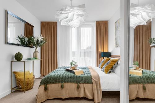 a bedroom with a bed and a mirror at Birmingham City Centre Luxury Apartment in Birmingham