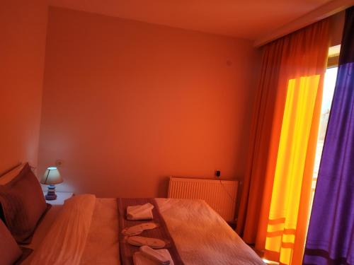 a bedroom with a bed and a window at Villa Bayern in Bakuriani in Bakuriani