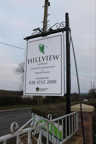 a sign for a hillview lodge on the side of a road at Hillview Lodge in Armagh