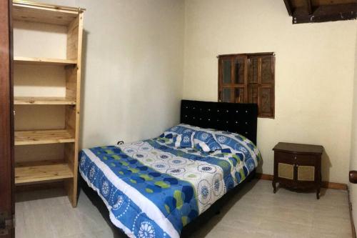 Giường trong phòng chung tại Glamping y Cabañas SPLENDOR VILLA EL EDEN