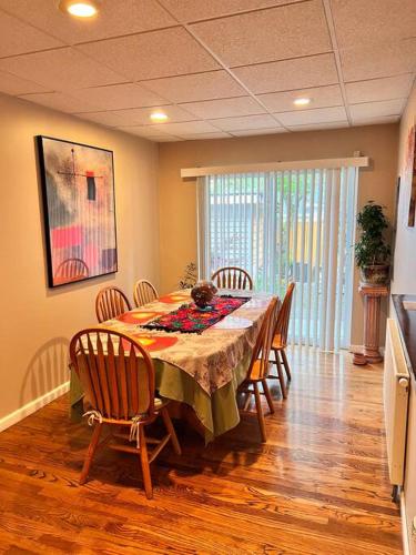 a dining room with a table with chairs and a tableablish at MountForest in Shoreline