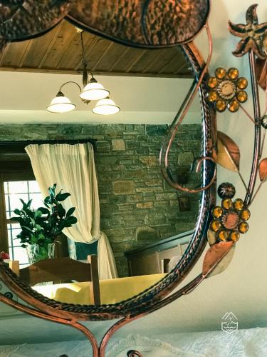 a mirror on the wall of a room with a table at Anna maria in Agios Dimitrios