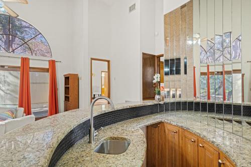 a kitchen with a sink and a counter top at Villa Española in San Antonio